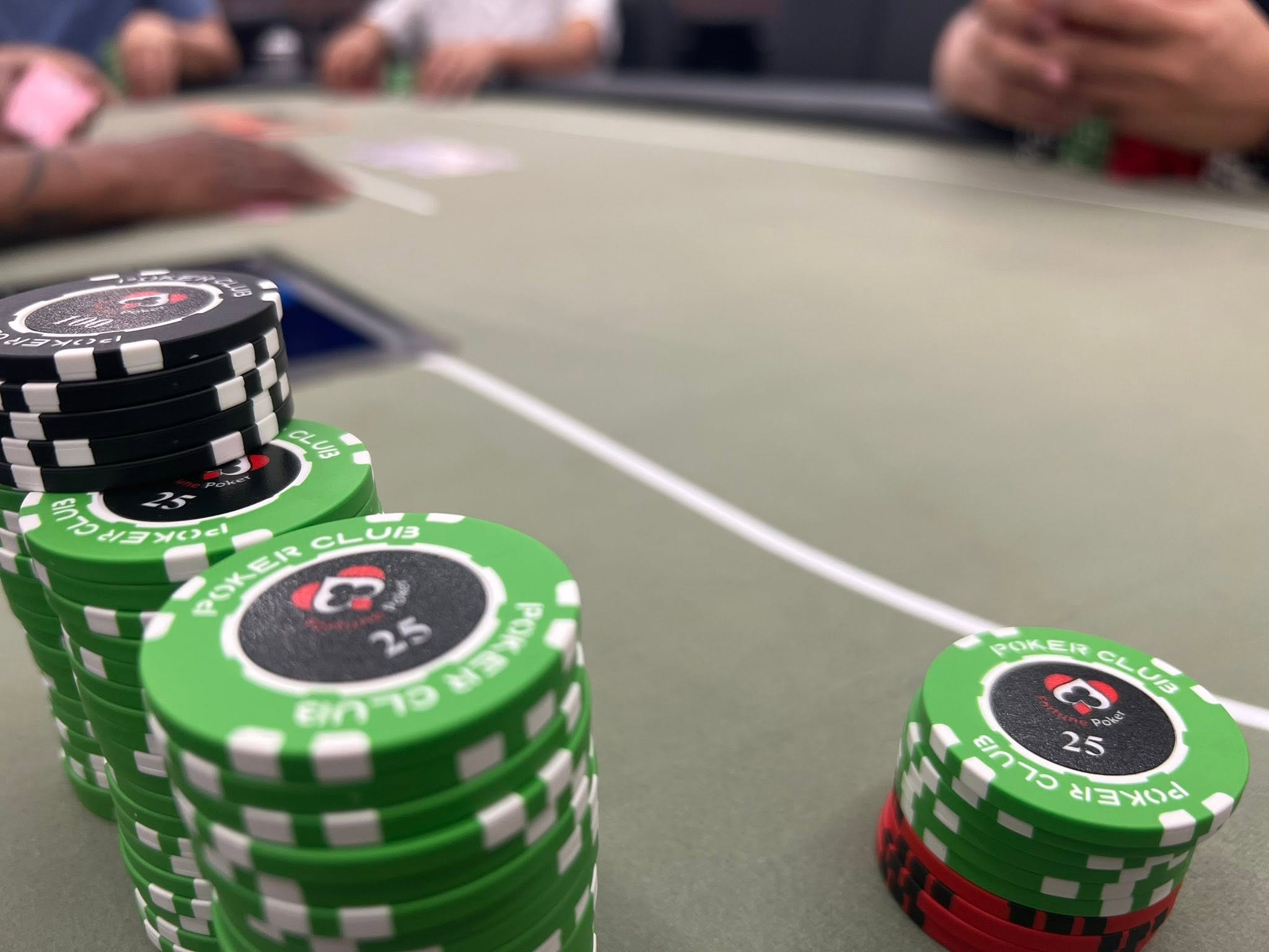Fortune Poker custom clay chips on the felt
